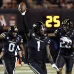 
              Vanderbilt's Elijah McAllister (1) celebrates after recovering a fumble in the second half of an NCAA college football game against Elon, Saturday, Sept. 3, 2022, in Nashville, Tenn. (AP Photo/Mark Zaleski)
            