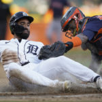 
              Houston Astros catcher Martin Maldonado, right, tags Detroit Tigers center fielder Riley Greene out at home plate in the first inning of a baseball game in Detroit, Monday, Sept. 12, 2022. (AP Photo/Paul Sancya)
            