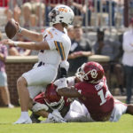 
              UTEP quarterback Gavin Hardison (2) is sacked by Oklahoma defensive lineman Reggie Grimes (14) in the first half of an NCAA college football game, Saturday, Sept. 3, 2022, in Norman, Okla. (AP Photo/Sue Ogrocki)
            
