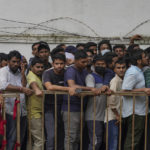 
              People line up to buy tickets for the third Twenty20 cricket match between India and Australia at Gymkhana grounds in Hyderabad, India, Thursday, Sept. 22, 2022. Earlier in the day 20 people were injured here in a stampede when sales of tickets opened. (AP Photo/Mahesh Kumar A.)
            