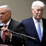 
              Kansas City Royals chairman and CEO John Sherman, right, walks behind Kansas City Royals general manager and president of baseball operations Dayton Moore during a news conference Wednesday, Sept. 21, 2022 in Kansas City, Mo., after Moore had been fired from his position with the baseball club. (Rich Sugg/The Kansas City Star via AP)
            