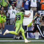 
              Seattle Seahawks tight end Will Dissly runs for a touchdown after catching a pass against the Denver Broncos during the first half of an NFL football game, Monday, Sept. 12, 2022, in Seattle. (AP Photo/Stephen Brashear)
            