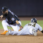 
              New York Mets second baseman Luis Guillorme tags out Pittsburgh Pirates' Greg Allen stealing second in the ninth inning of a baseball game, Friday, Sept. 16, 2022, in New York. (AP Photo/Corey Sipkin)
            