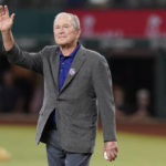 
              Former President George W. Bush waves as he takes the field to participate in the ceremonial irst pitch to recognize the 21st anniversary of Patriot Day before a baseball game between the Toronto Blue Jays and the Texas Rangers in Arlington, Texas, Sunday, Sept. 11, 2022. (AP Photo/LM Otero)
            