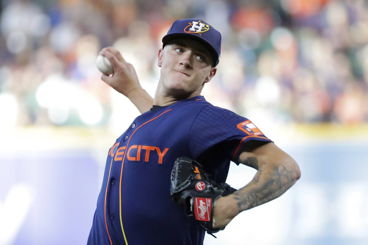 Houston Astros starting pitcher Hunter Brown throws against the Texas Rangers during the first inni...