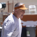 
              FILE - Texas offensive coordinator Kyle Flood works with the offensive line before the Texas Orange and White Spring Scrimmage in Austin, Texas, Saturday, April 24, 2021. Flood followed Texas head coach Steve Sarkisian from Alabama. (AP Photo/Michael Thomas, File)
            