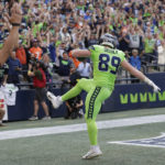 
              Seattle Seahawks tight end Will Dissly catches a pass for a touchdown against the Denver Broncos during the first half of an NFL football game, Monday, Sept. 12, 2022, in Seattle. (AP Photo/John Froschauer)
            