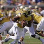 
              Georgia Tech quarterback Jeff Sims (10) throws on the run in the first half of an NCAA college football game against Mississippi, Saturday, Sept. 17, 2022, in Atlanta. (AP Photo/John Bazemore)
            