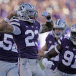 
              Kansas State cornerback Julius Brents (23) celebrate after making a tackle during the first half of an NCAA college football game against South Dakota Saturday, Sept. 3, 2022, in Manhattan, Kan. (AP Photo/Charlie Riedel)
            