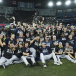 
              The New York Yankees pose for team photographs after defeating the Toronto Blue Jays to clinch the AL East, in Toronto on Tuesday, Sept. 27, 2022. (Nathan Denette/The Canadian Press via AP)
            