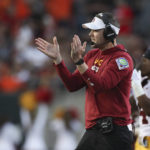 
              Southern California coach Lincoln Riley applauds during the first half of the team's NCAA college football game against Oregon State on Saturday, Sept. 24, 2022, in Corvallis, Ore. (AP Photo/Amanda Loman)
            