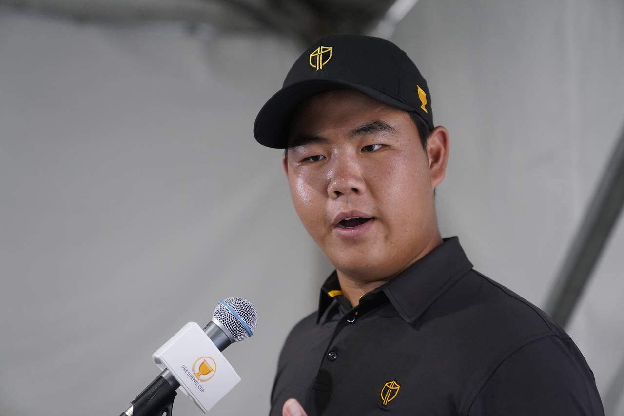 Tom Kim, of South Korea, speaks during a news conference after practice for the Presidents Cup golf...