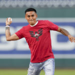 
              D.C. United's Andy Najar throws a ceremonial first pitch before a baseball game between the Washington Nationals and the Miami Marlins at Nationals Park, Friday, Sept. 16, 2022, in Washington. (AP Photo/Jess Rapfogel)
            