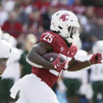 
              Washington State running back Nakia Watson carries the ball during the first half of an NCAA college football game against Colorado State, Saturday, Sept. 17, 2022, in Pullman, Wash. (AP Photo/Young Kwak)
            