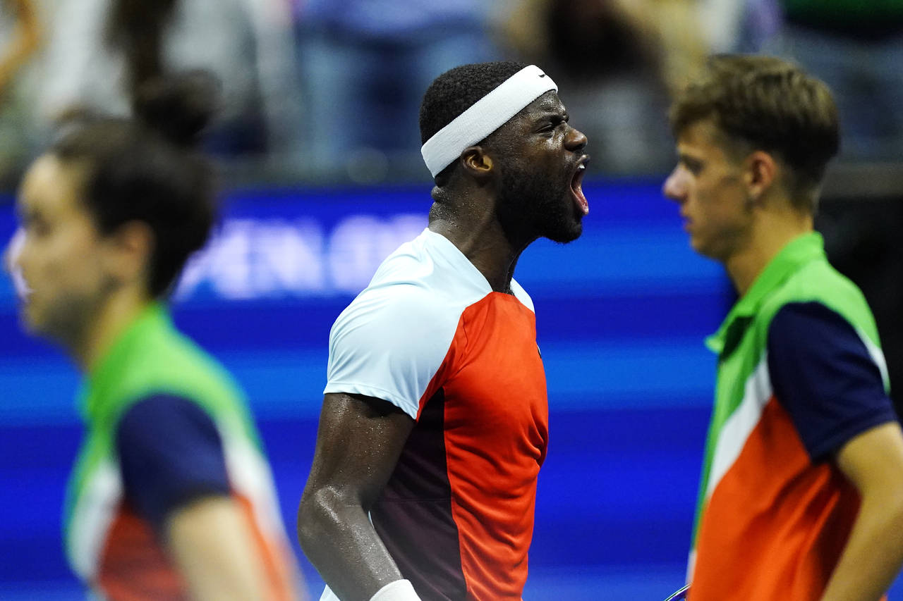 Frances Tiafoe, of the United States, reacts after winning a game against Carlos Alcaraz, of Spain,...
