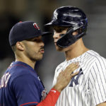 
              Minnesota Twins' Carlos Correa, left, talks to New York Yankees' Aaron Judge after the final out of the ninth inning of a baseball game Thursday, Sept. 8, 2022, in New York. (AP Photo/Adam Hunger)
            