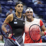 
              Caroline Garcia, of France, poses for a photo with Ons Jabeur, of Tunisia, before the start of the women's singles semifinals of the U.S. Open tennis championships, Thursday, Sept. 8, 2022, in New York. (AP Photo/John Minchillo)
            