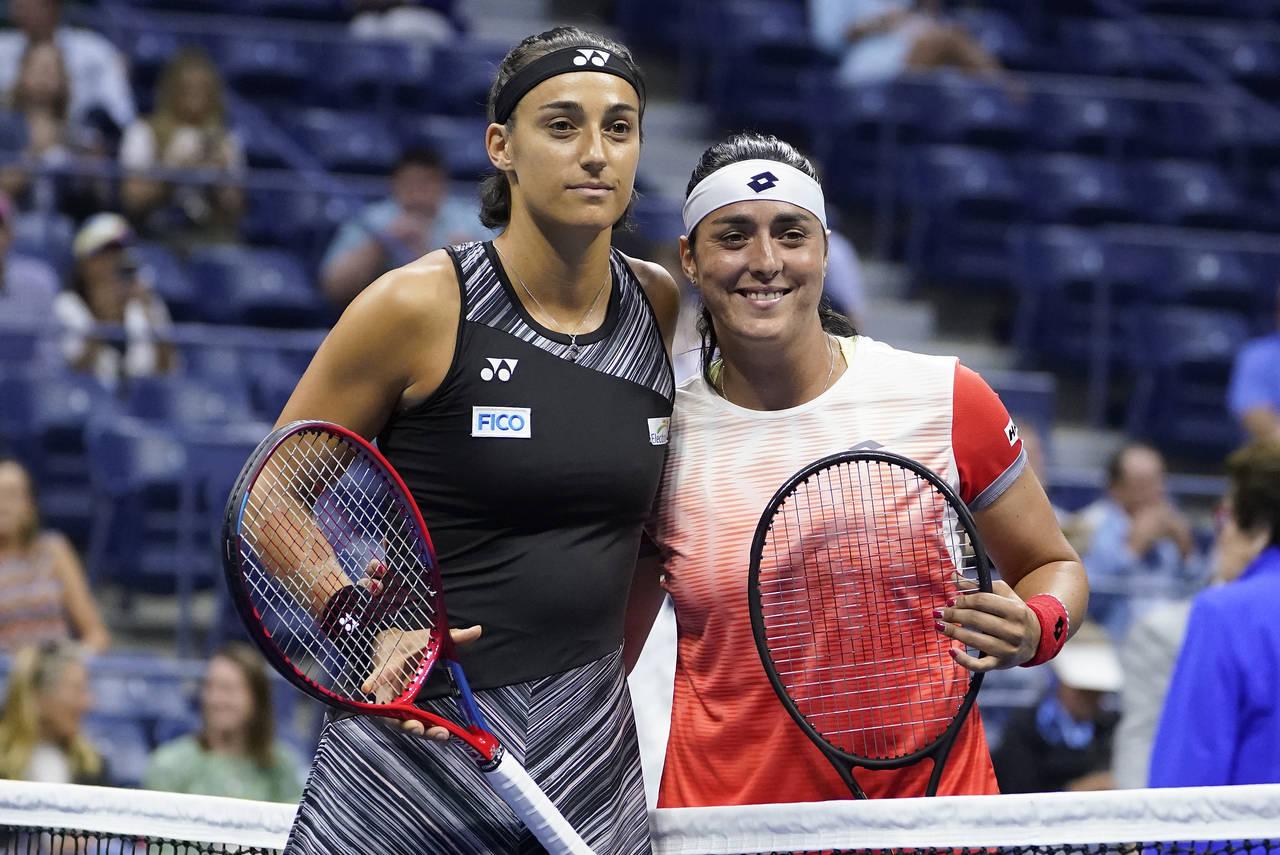 Caroline Garcia, of France, poses for a photo with Ons Jabeur, of Tunisia, before the start of the ...