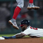 
              Atlanta Braves' Michael Harris II steals second base as Washington Nationals shortstop Luis Garcia jumps for the throw the seventh inning of a baseball game Tuesday, Sept. 20, 2022, in Atlanta. (AP Photo/John Bazemore)
            