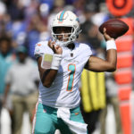 
              Miami Dolphins quarterback Tua Tagovailoa (1) aims a pass during the first half of an NFL football game against the Baltimore Ravens, Sunday, Sept. 18, 2022, in Baltimore. (AP Photo/Nick Wass)
            