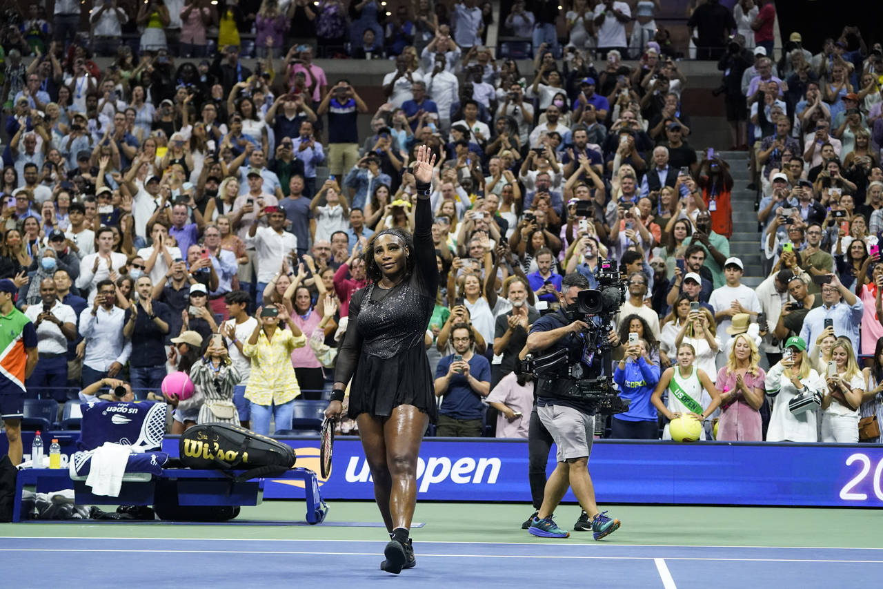 Serena Williams, of the United States, waves to the crowd after losing to Ajla Tomljanovic, of Aust...
