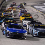 
              Chris Buescher, front left, and Kevin Harvick (4) lead the pack during a restart at a NASCAR Cup Series auto race at Bristol Motor Speedway Saturday, Sept. 17, 2022, in Bristol, Tenn. (AP Photo/Mark Humphrey)
            