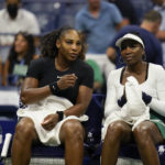 
              Serena Williams, left, and Venus Williams, of the United States, sit together during their first-round doubles match against Lucie Hradecká and Linda Nosková, of the Czech Republic, at the U.S. Open tennis championships, Thursday, Sept. 1, 2022, in New York. (AP Photo/Charles Krupa)
            