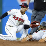 
              Baltimore Orioles' Gunnar Henderson steals second base as Cleveland Guardians second baseman Andres Gimenez attempts the tag during the ninth inning of a baseball game Thursday, Sept. 1, 2022, in Cleveland. (AP Photo/Ron Schwane)
            