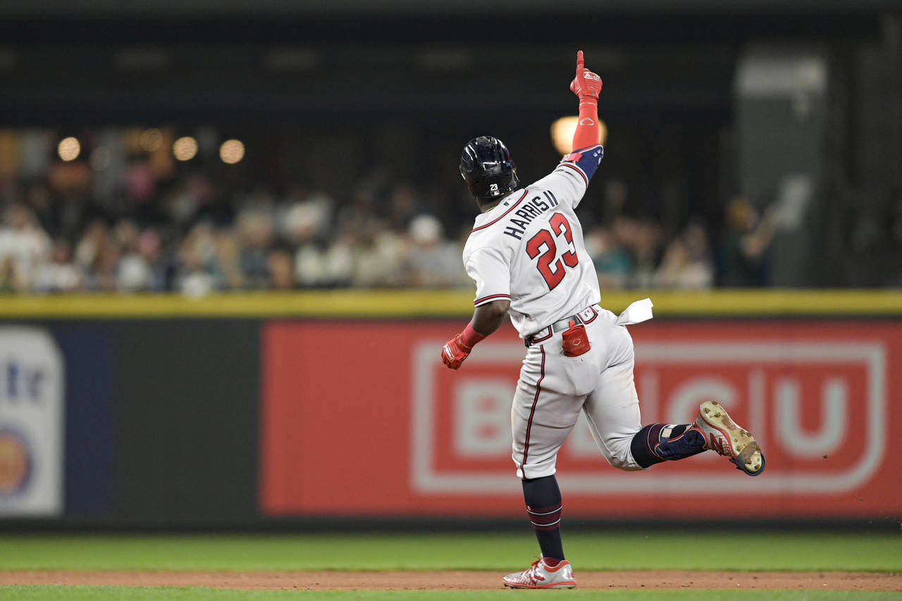 Atlanta Braves' Michael Harris II gestures as he runs the bases after hitting a solo home run durin...