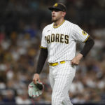 
              San Diego Padres starting pitcher Joe Musgrove walks back to the dugout after getting pulled in the fifth inning by manager Bob Melvin during a baseball game against the Arizona Diamondbacks Tuesday, Sept. 6, 2022, in San Diego. (AP Photo/Brandon Sloter)
            