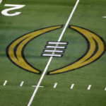 
              FILE - The College Football Playoff logo is shown on the field at AT&T Stadium before the Rose Bowl NCAA college football game between Notre Dame and Alabama in Arlington, Texas, Jan. 1, 2021. The university presidents who oversee the College Football Playoff voted Friday, Sept. 2, 2022, to expand the postseason model for determining a national champion from four to 12 teams no later than the 2026 season. (AP Photo/Roger Steinman, File)
            