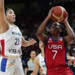 
              United States' Ariel Atkins shoots at goal as South Korea's Kim Danbi , left, attempts to block during their game at the women's Basketball World Cup in Sydney, Australia, Monday, Sept. 26, 2022. (AP Photo/Mark Baker)
            