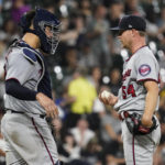 
              Minnesota Twins catcher Gary Sanchez, left, talks with starting pitcher Sonny Gray during the fourth inning of a baseball game against the Chicago White Sox in Chicago, Friday, Sept. 2, 2022. (AP Photo/Nam Y. Huh)
            