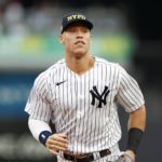
              New York Yankees center fielder Aaron Judge warms up before a baseball game against the Tampa Bay Rays on Sunday, Sept. 11, 2022, in New York. (AP Photo/Noah K. Murray)
            