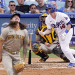 
              Los Angeles Dodgers' Will Smith, right, drops his bat as he hits a solo home run while San Diego Padres starting pitcher Mike Clevinger, left, watches along with catcher Austin Nola during the fourth inning of a baseball game Sunday, Sept. 4, 2022, in Los Angeles. (AP Photo/Mark J. Terrill)
            