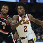 
              FILE - Cleveland Cavaliers' Collin Sexton (2) drives against Portland Trail Blazers' Damian Lillard (0) in the first half of an NBA basketball game, Wednesday, Nov. 3, 2021, in Cleveland. Cleveland made its acquisition of All-Star guard Donovan Mitchell in a trade with Utah official on Saturday, Sept. 3.  Cleveland sent guard Collin Sexton, guard Lauri Markkanen and rookie guard Ochai Agbaji to Utah along with unprotected first-round draft picks in 2025, 2027 and 2029. (AP Photo/Tony Dejak, File)
            