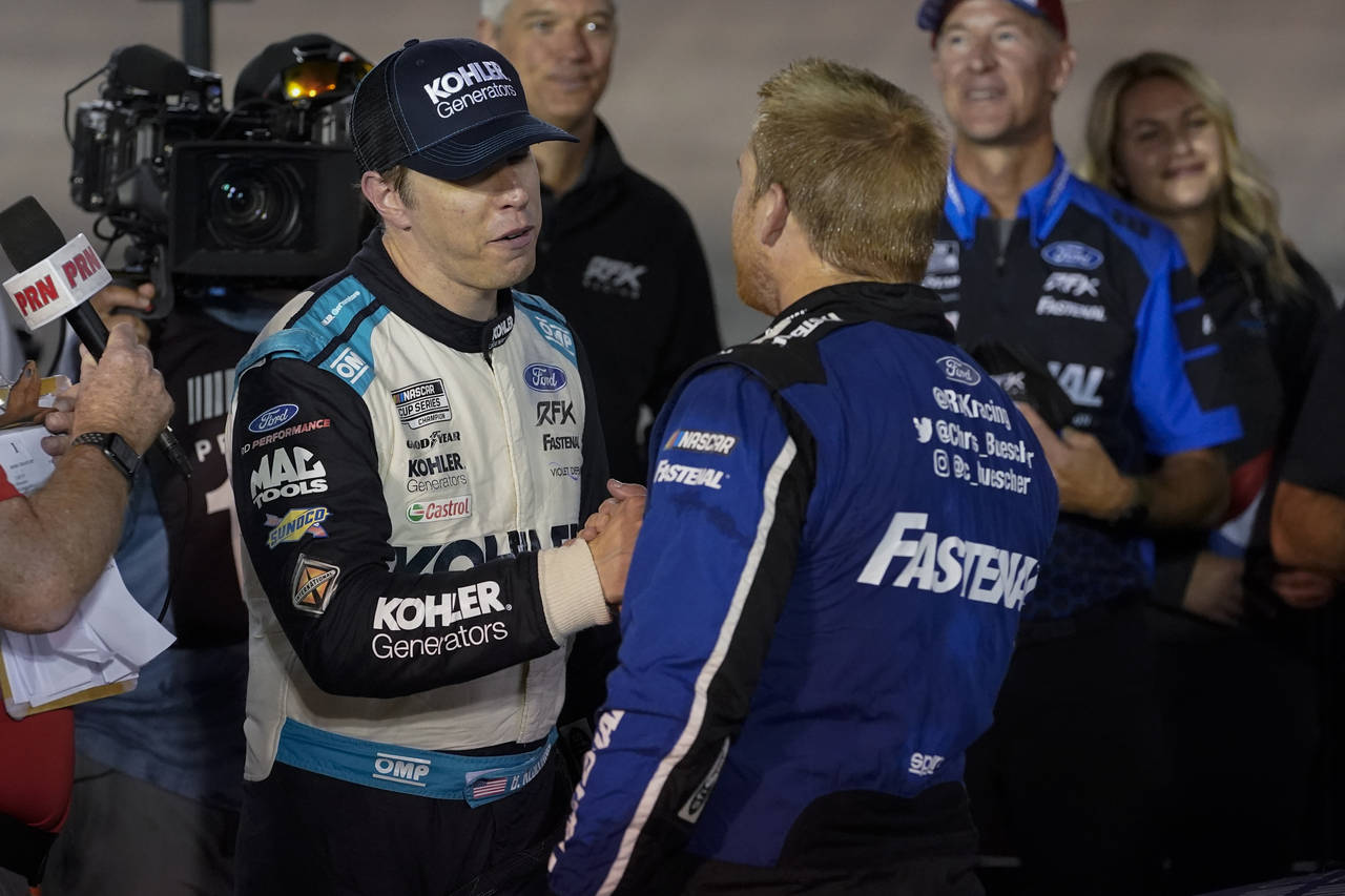 Brad Keselowski, left, congratulates Chris Buescher after Buescher won a NASCAR Cup Series auto rac...
