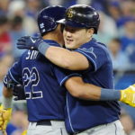 
              Tampa Bay Rays' Ji-Man Choi, right, celebrates his solo home run against the Toronto Blue Jays with Jose Siri (22) during the third inning of the second baseball game of a doubleheader Tuesday, Sept. 13, 2022, in Toronto. (Frank Gunn/The Canadian Press via AP)
            