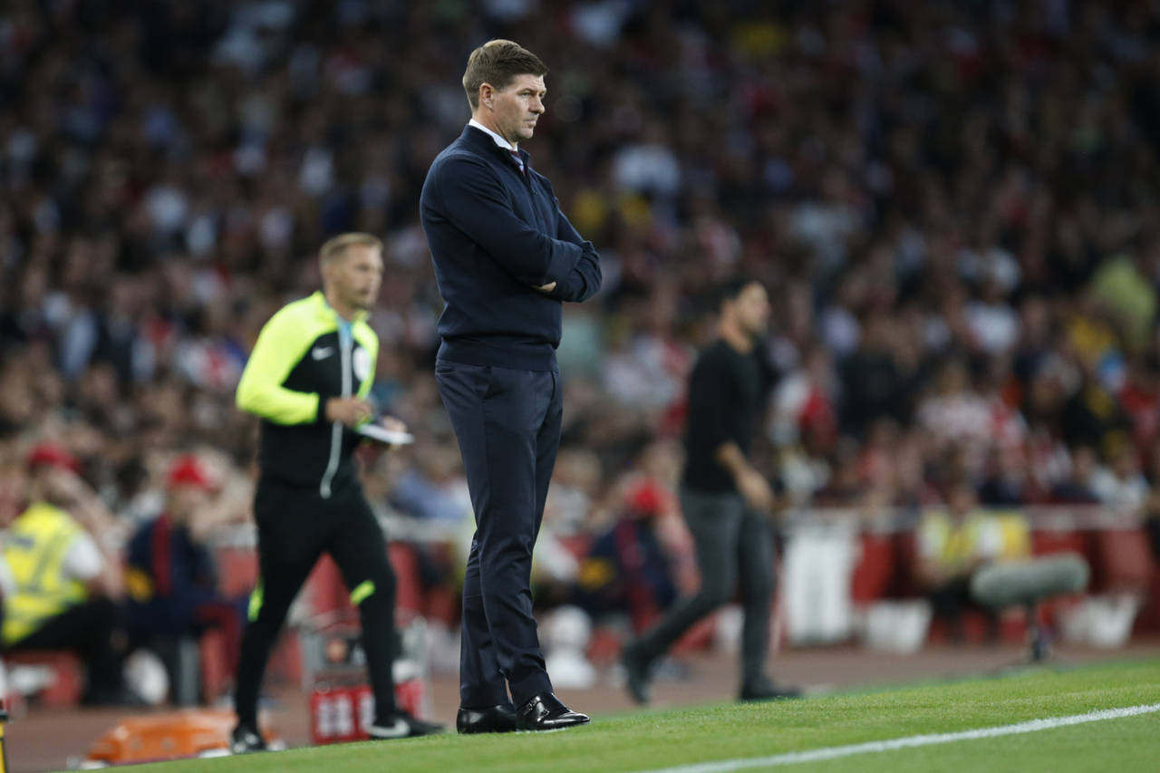 Aston Villa's head coach Steven Gerrard watches the English Premier League soccer match between Ars...