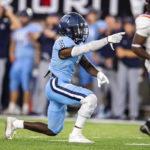 
              Old Dominion running back Elijah Davis (5) signals for a first down during an NCAA college football game against Virginia Tech, Friday, Sept. 2, 2022, in Norfolk, Va. (AP Photo/Mike Caudill)
            