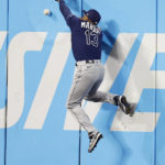 
              Tampa Bay Rays right fielder Manuel Margot cannot make a leaping catch on a one-run triple by Cleveland Guardians' Jose Ramirez during the third inning of a baseball game, Tuesday, Sept. 27, 2022, in Cleveland. (AP Photo/Ron Schwane)
            