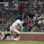 
              Atlanta Braves' Ozzie Albies hits a single in the fourth inning of a baseball game against the Philadelphia Phillies, Saturday, Sept. 17, 2022, in Atlanta. (AP Photo/Brynn Anderson)
            