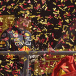 
              Red Bull driver Max Verstappen of the Netherlands celebrates on the podium after winning the Italian Grand Prix race at the Monza racetrack, in Monza, Italy, Sunday, Sept. 11, 2022. (AP Photo/Antonio Calanni)
            