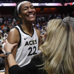 
              Las Vegas Aces head coach Becky Hammon, right, celebrates with Las Vegas Aces' A'ja Wilson after their win in the WNBA basketball finals against the Connecticut Sun, Sunday, Sept. 18, 2022, in Uncasville, Conn. (AP Photo/Jessica Hill)
            