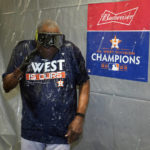 
              Houston Astros manager Dusty Baker Jr. ducks away from being sprayed with champagne after the Astros clinched the American League West title with a win over the Tampa Bay Rays after a baseball game Monday, Sept. 19, 2022, in St. Petersburg, Fla. (AP Photo/Chris O'Meara)
            