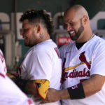 
              St. Louis Cardinals' Yadier Molina, left, gets a hug from teammate Albert Pujols after hitting his second home run of a baseball game against the Washington Nationals during the fourth inning Thursday, Sept. 8, 2022, in St. Louis. Molina also homered in the second. (AP Photo/Jeff Roberson)
            