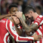 
              Atletico Madrid's Antoine Griezmann, left, celebrates with teammates after scoring his side's second goal during the Champions League Group B soccer match between Atletico Madrid and Porto at the Metropolitano stadium in Madrid, Spain, Wednesday, Sept. 7, 2022. (AP Photo/Bernat Armangue)
            