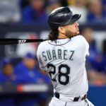 TORONTO, ON - OCTOBER 07:  Eugenio Suarez #28 of the Seattle Mariners hits a 1 run double in the first inning during Game One of the AL Wild Card series against the Toronto Blue Jays at Rogers Centre on October 7, 2022 in Toronto, Ontario, Canada.  (Photo by Vaughn Ridley/Getty Images)
