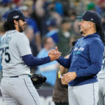 TORONTO, ON - OCTOBER 07: Luis Castillo #21 of the Seattle Mariners (R) celebrates with Andres Munoz #75 after their team defeated the Toronto Blue Jays in Game One of their AL Wild Card series at Rogers Centre on October 7, 2022 in Toronto, Ontario, Canada.  (Photo by Mark Blinch/Getty Images)