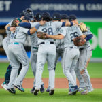 TORONTO, ON - OCTOBER 07: Seattle Mariners players celebrate in the infield after defeating the Toronto Blue Jays in Game One of their AL Wild Card series at Rogers Centre on October 7, 2022 in Toronto, Ontario, Canada.  (Photo by Mark Blinch/Getty Images)